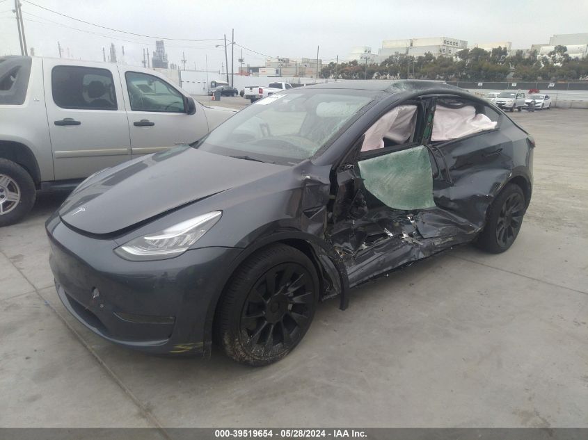 2023 Tesla Model Y Awd/Long Range Dual Motor All-Wheel Drive VIN: 7SAYGDEE0PA044909 Lot: 39519654