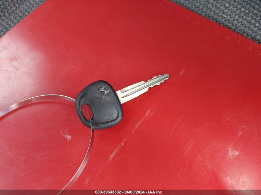 1999 Hyundai Tiburon VIN: KMHJG24F2XU141953 Lot: 39543382