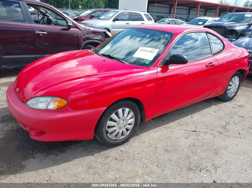1999 Hyundai Tiburon VIN: KMHJG24F2XU141953 Lot: 39543382