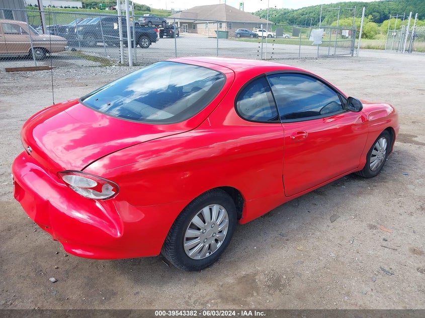 1999 Hyundai Tiburon VIN: KMHJG24F2XU141953 Lot: 39543382