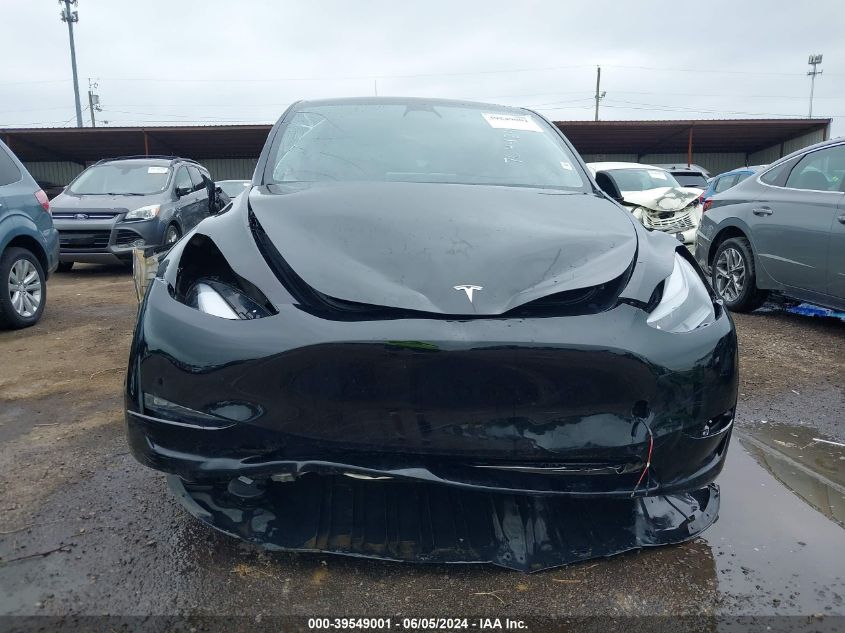 2023 Tesla Model Y Awd/Long Range Dual Motor All-Wheel Drive VIN: 7SAYGDEE8PF704424 Lot: 39549001