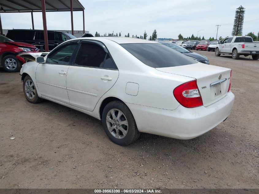 2004 Toyota Camry Le VIN: JTDBE30K540285894 Lot: 39563390