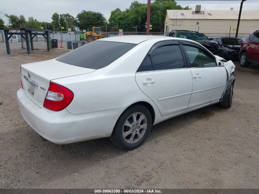 2004 Toyota Camry Le VIN: JTDBE30K540285894 Lot: 39563390