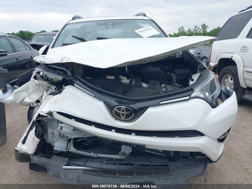 VIN JTMRFREV6JJ260509 2018 TOYOTA RAV4 XLE