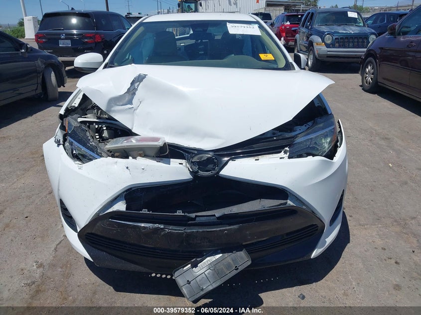 2017 Toyota Corolla Le VIN: 5YFBURHEXHP676829 Lot: 39579352