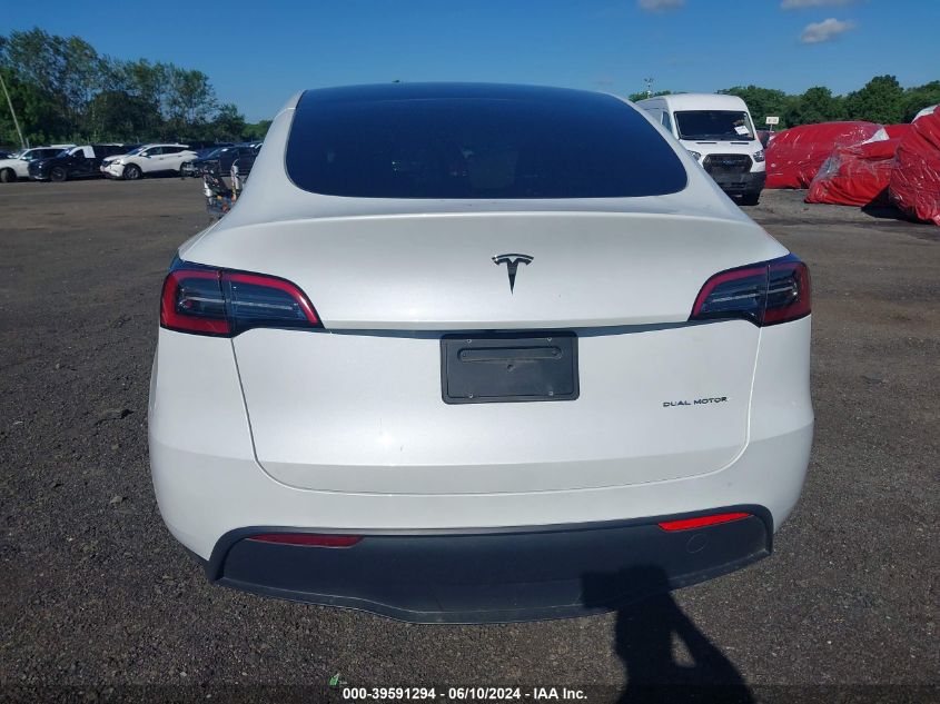 2023 Tesla Model Y Awd/Long Range Dual Motor All-Wheel Drive VIN: 7SAYGAEE4PF779202 Lot: 39591294