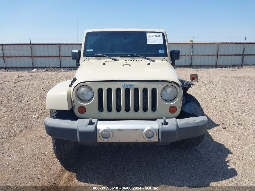 2011 Jeep Wrangler Unlimited Sahara VIN: 1J4HA5H13BL571858 Lot: 39595618