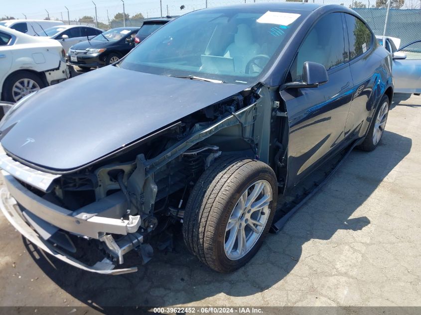 2023 Tesla Model Y Awd/Long Range Dual Motor All-Wheel Drive VIN: 7SAYGDEE7PA157112 Lot: 39622452