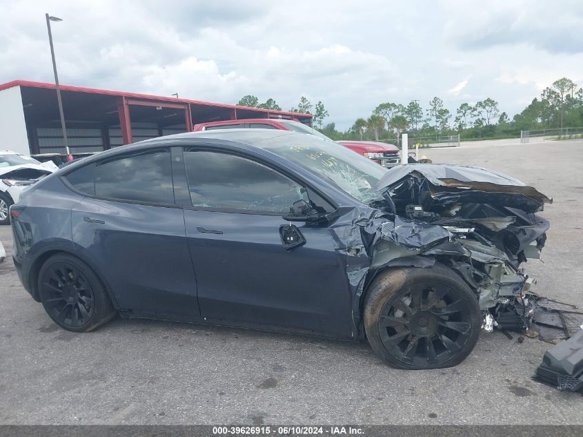 2023 Tesla Model Y Awd/Long Range Dual Motor All-Wheel Drive VIN: 7SAYGAEE8PF708097 Lot: 39626915