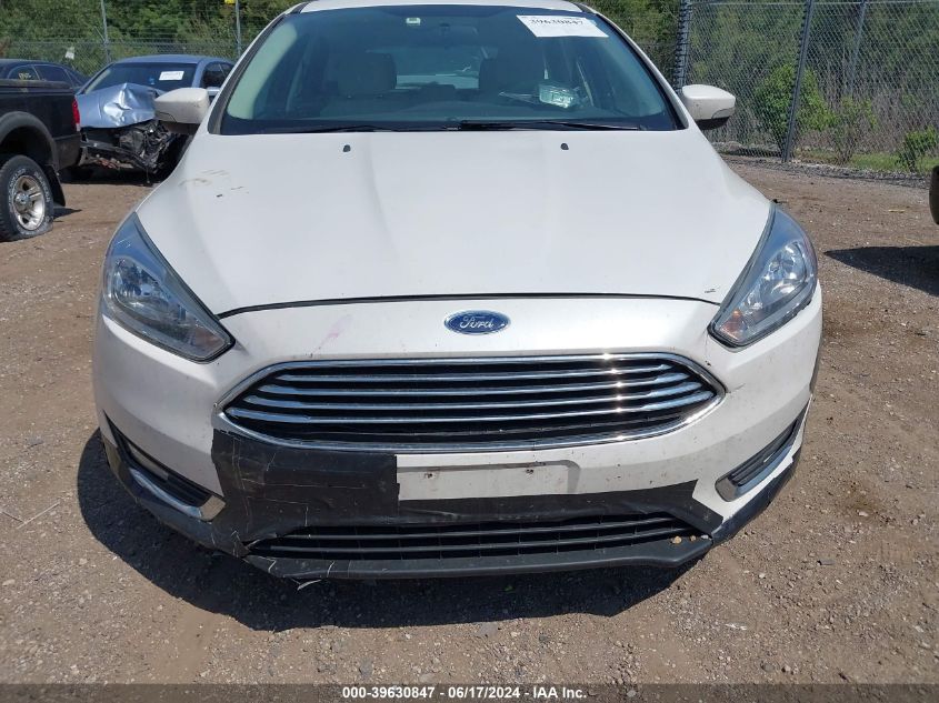 2016 Ford Focus Titanium VIN: 1FADP3N26GL299629 Lot: 39630847