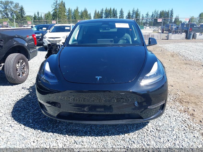 2023 Tesla Model Y Awd/Long Range Dual Motor All-Wheel Drive VIN: 7SAYGAEEXPF799616 Lot: 39652431