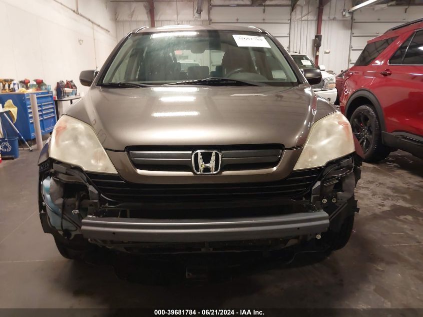 2009 Honda Cr-V Lx VIN: 3CZRE38329G704812 Lot: 39681784