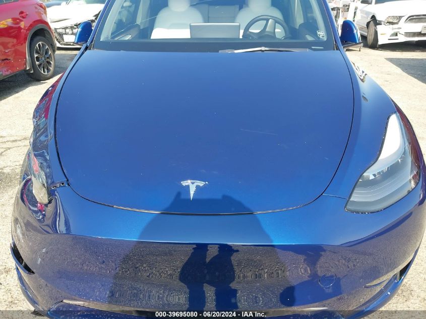 2023 Tesla Model Y Awd/Long Range Dual Motor All-Wheel Drive VIN: 7SAYGAEE4PF640204 Lot: 39695080