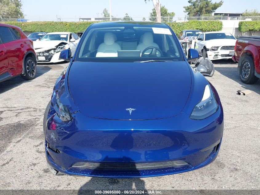 2023 Tesla Model Y Awd/Long Range Dual Motor All-Wheel Drive VIN: 7SAYGAEE4PF640204 Lot: 39695080