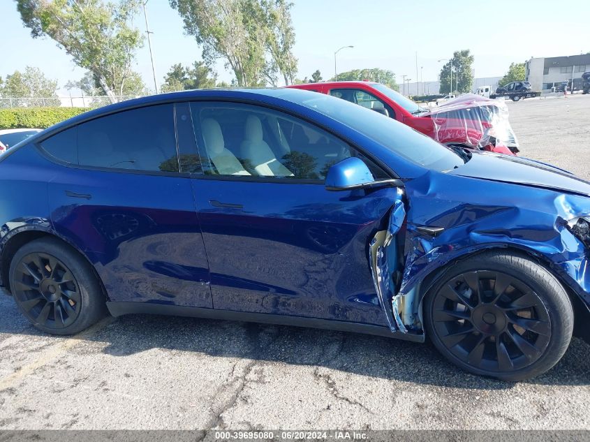 2023 Tesla Model Y Awd/Long Range Dual Motor All-Wheel Drive VIN: 7SAYGAEE4PF640204 Lot: 39695080