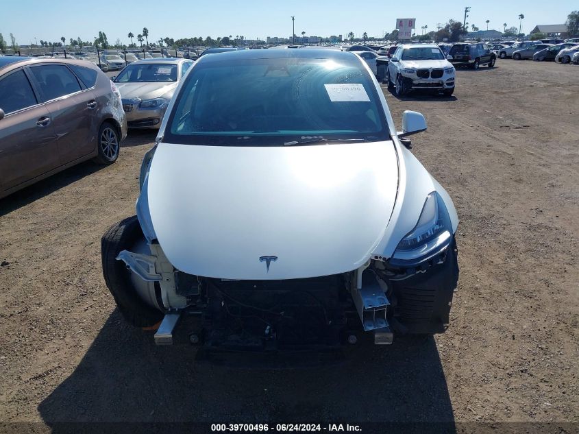 2023 Tesla Model Y Awd/Long Range Dual Motor All-Wheel Drive VIN: 7SAYGDEEXPA063631 Lot: 39700496