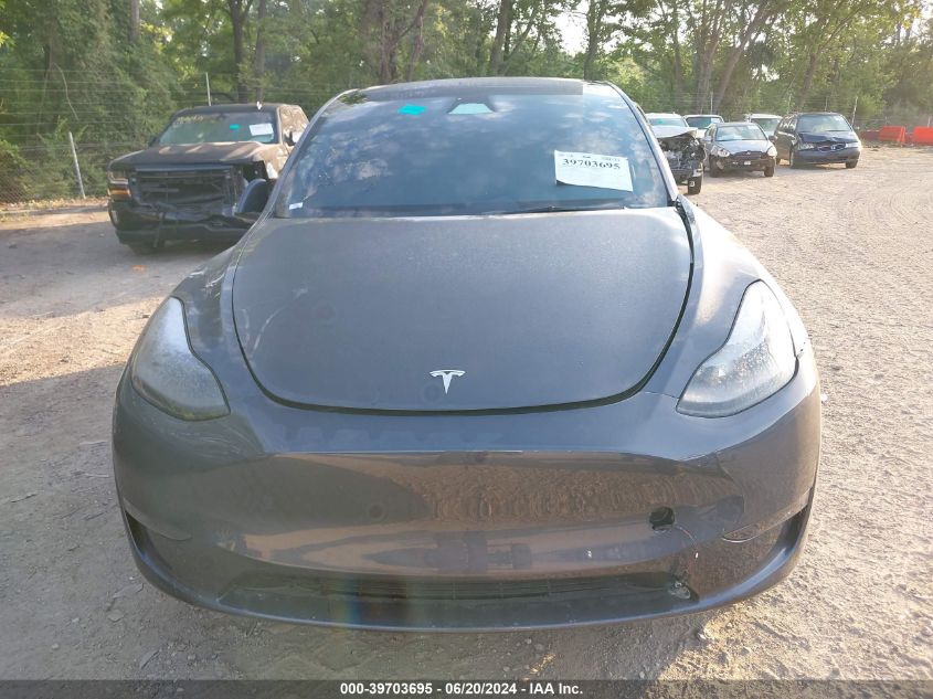 2023 Tesla Model Y VIN: 7SAYGDEE4PA197423 Lot: 39703695