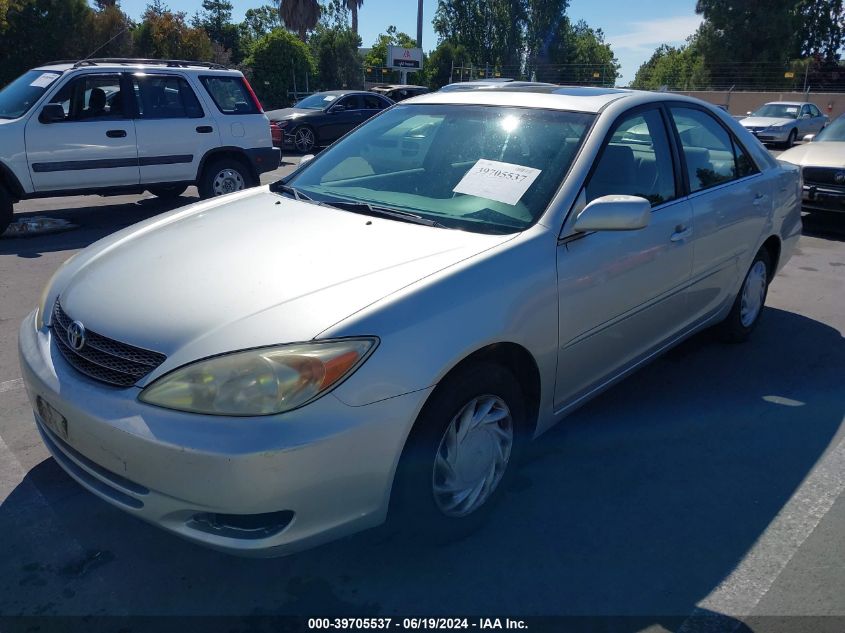 2003 Toyota Camry Le VIN: JTDBE32K030169384 Lot: 39705537