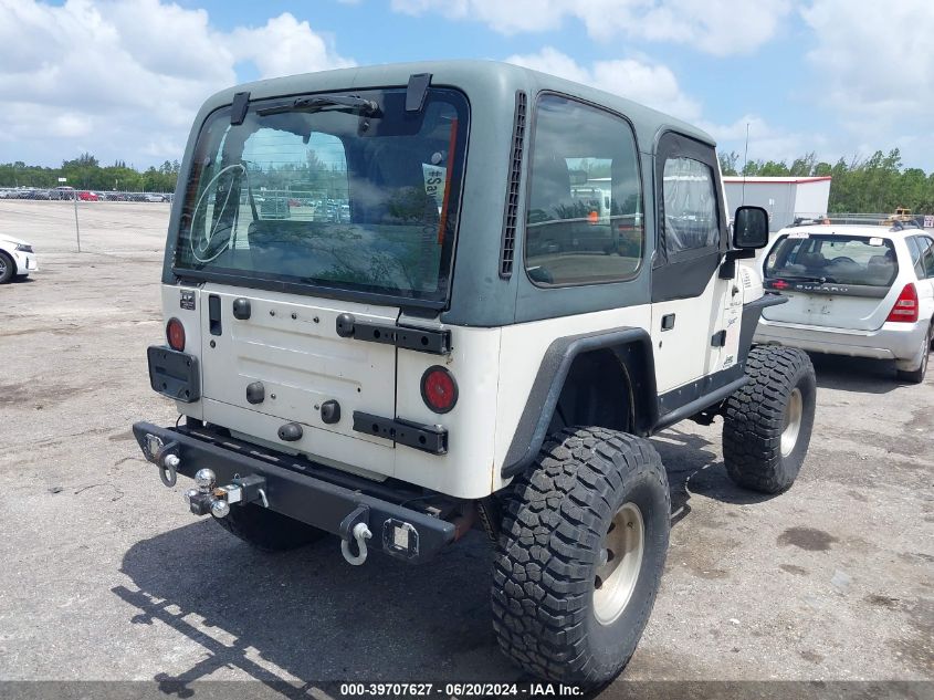 1998 Jeep Wrangler Sport VIN: 1J4FY19S0WP721409 Lot: 39707627