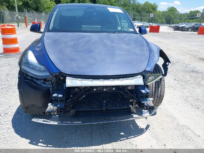 2023 Tesla Model Y Awd/Long Range Dual Motor All-Wheel Drive VIN: 7SAYGDEE2PA098261 Lot: 39709923