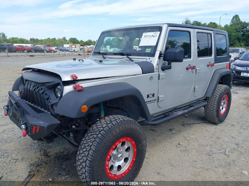 2007 Jeep Wrangler Unlimited X VIN: 1J4GA39167L112667 Lot: 39711563