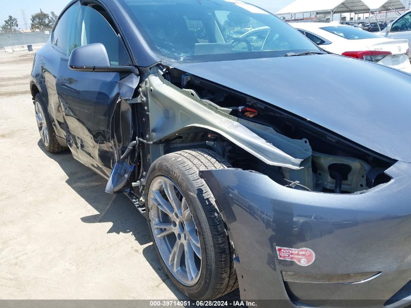 2023 Tesla Model Y Awd/Long Range Dual Motor All-Wheel Drive VIN: 7SAYGAEE9PF932494 Lot: 39714051