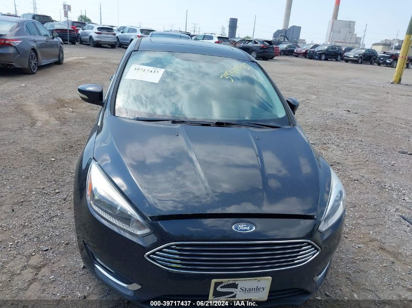 2015 Ford Focus Titanium VIN: 1FADP3J26FL345285 Lot: 39717437