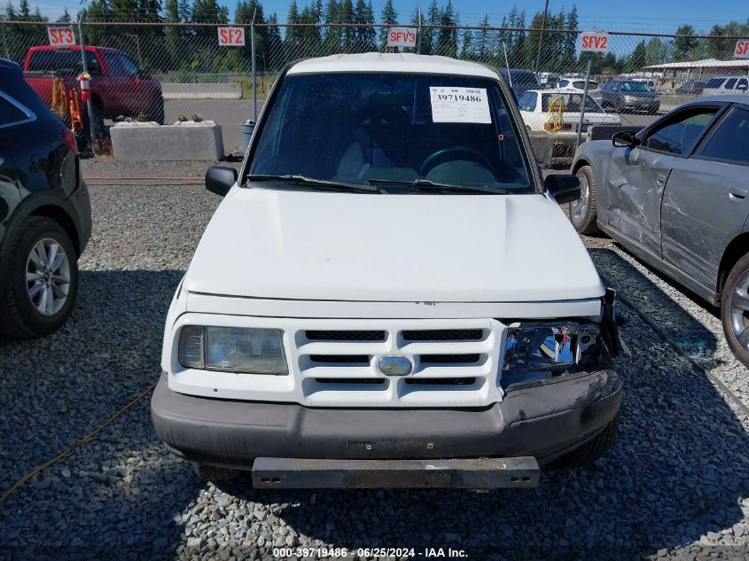 1998 Chevrolet Tracker VIN: 2CNBJ1360W6921786 Lot: 39719486