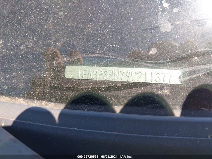 2009 Ford Focus S VIN: 1FAHP34N79W211377 Lot: 39720591