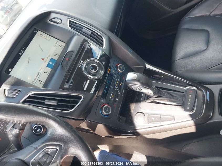 2016 Ford Focus Titanium VIN: 1FADP3J2XGL313263 Lot: 39754303