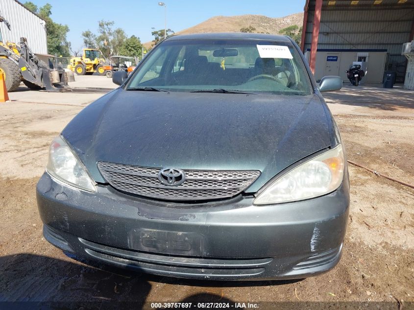 2004 Toyota Camry Le VIN: JTDBE32K740270312 Lot: 39757697