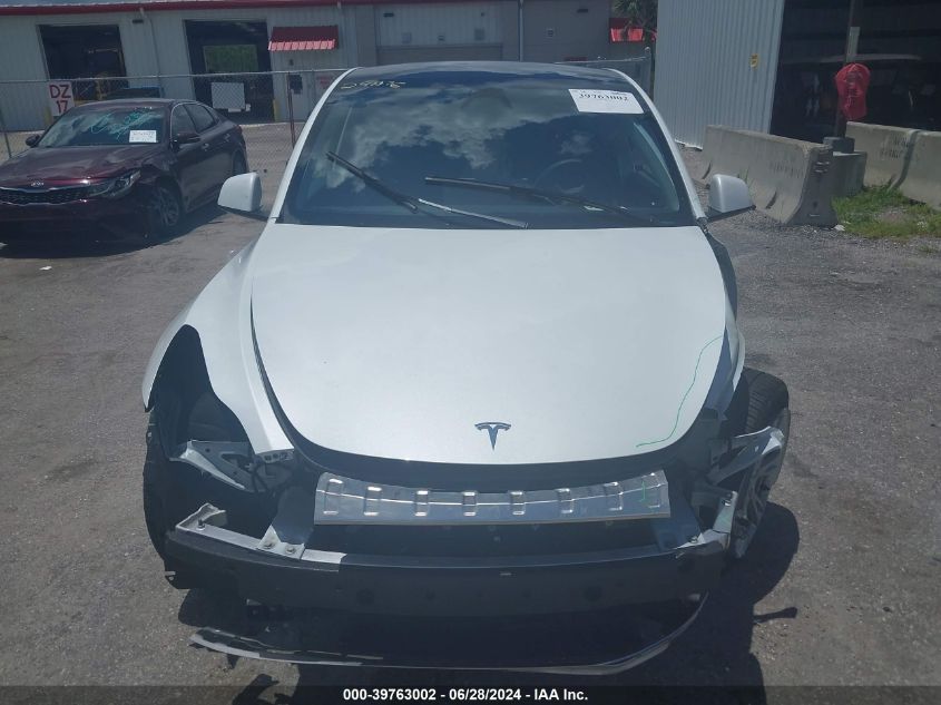 2023 Tesla Model Y Awd/Long Range Dual Motor All-Wheel Drive VIN: 7SAYGDEE4PA153101 Lot: 39763002