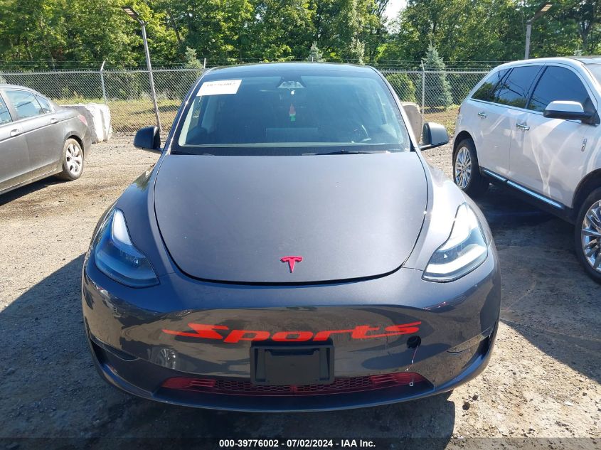 2023 Tesla Model Y Awd/Long Range Dual Motor All-Wheel Drive VIN: 7SAYGAEE5PF927504 Lot: 39776002