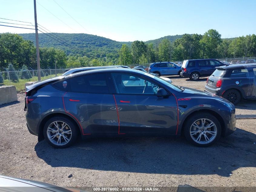 2023 Tesla Model Y Awd/Long Range Dual Motor All-Wheel Drive VIN: 7SAYGAEE5PF927504 Lot: 39776002