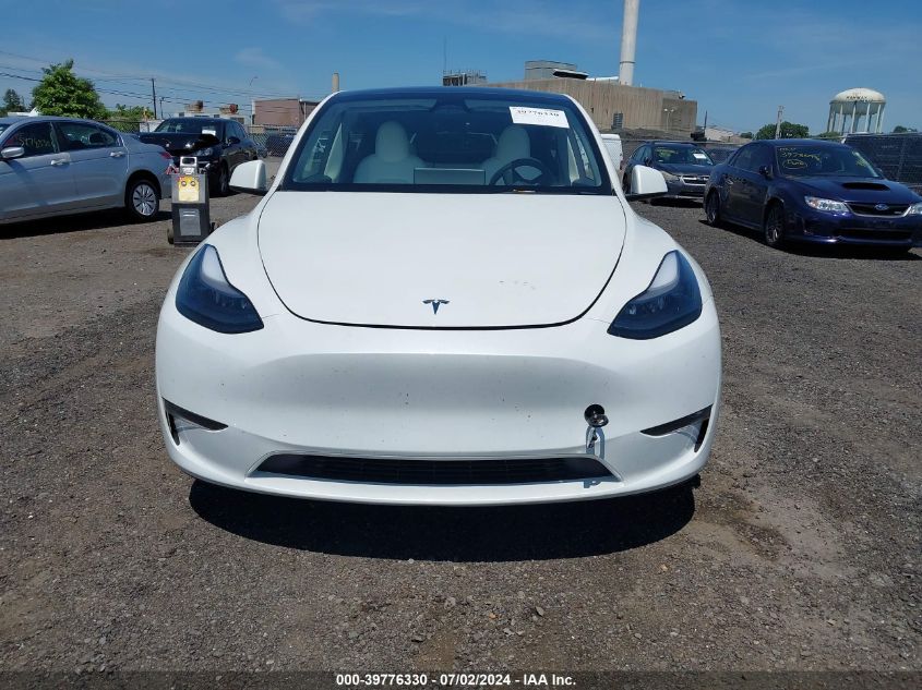 2023 Tesla Model Y VIN: 7SAYGDEF0PF807653 Lot: 39776330