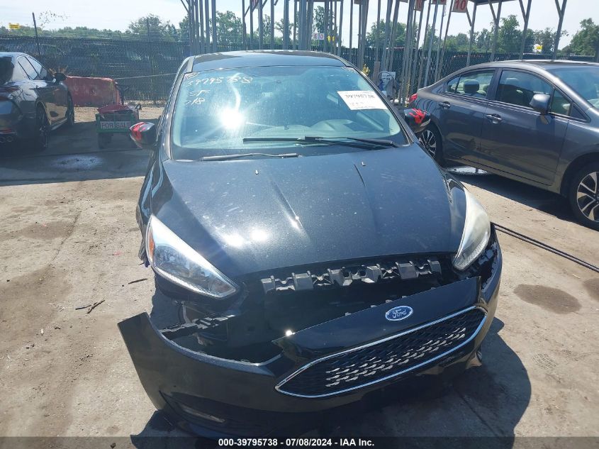 2015 Ford Focus Se VIN: 1FADP3F24FL381033 Lot: 39795738