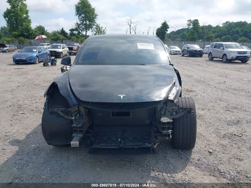 2023 Tesla Model Y Awd/Long Range Dual Motor All-Wheel Drive VIN: 7SAYGDEE0PA141205 Lot: 39807819