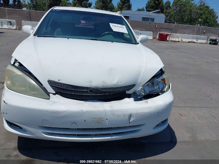 2004 Toyota Camry Le VIN: JTDBE32K240274199 Lot: 39821662