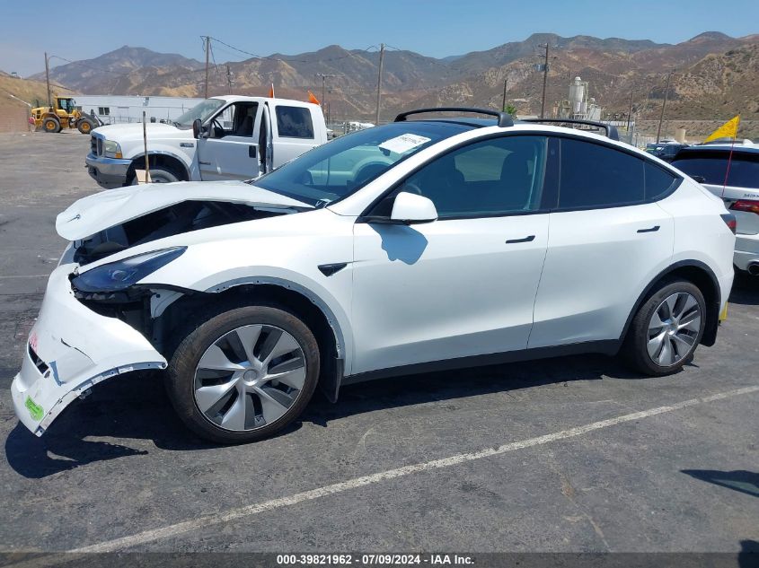 2023 Tesla Model Y Awd/Long Range Dual Motor All-Wheel Drive VIN: 7SAYGDEE4PF618575 Lot: 39821962