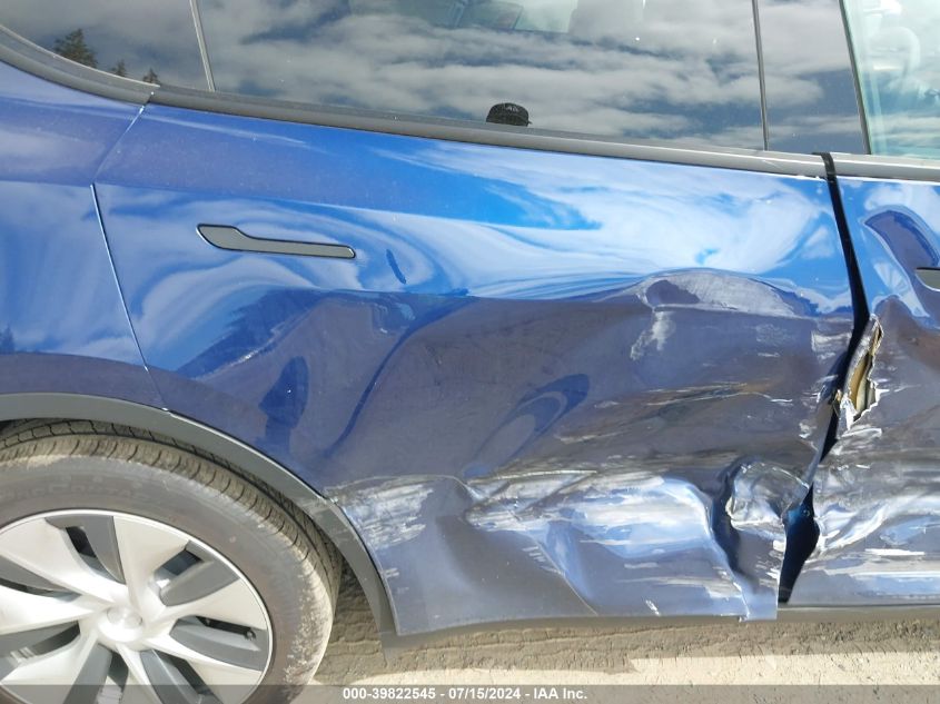 2023 Tesla Model Y Awd/Long Range Dual Motor All-Wheel Drive VIN: 7SAYGAEE8PF665249 Lot: 39822545