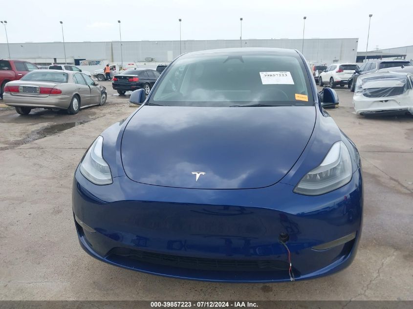 2023 Tesla Model Y Awd/Long Range Dual Motor All-Wheel Drive VIN: 7SAYGAEE9PF869381 Lot: 39857223