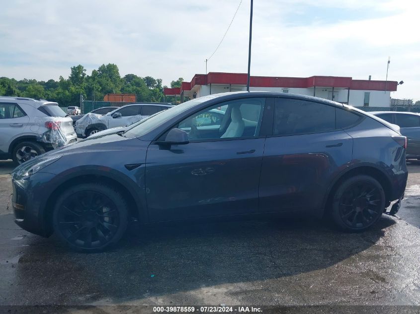 2023 Tesla Model Y Awd/Long Range Dual Motor All-Wheel Drive VIN: 7SAYGDEE3PA180824 Lot: 39878559