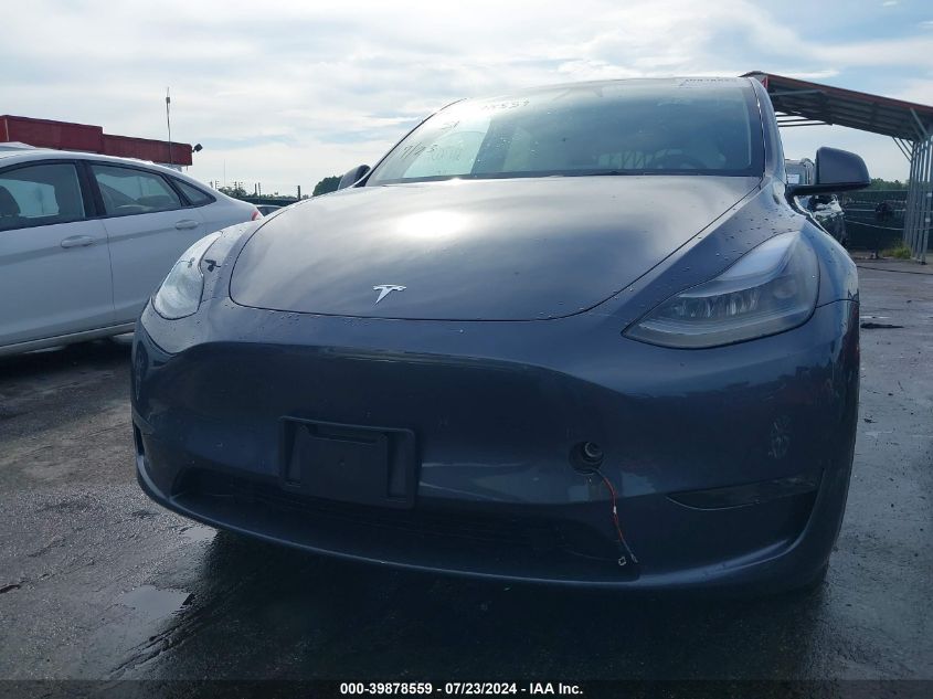 2023 Tesla Model Y Awd/Long Range Dual Motor All-Wheel Drive VIN: 7SAYGDEE3PA180824 Lot: 39878559