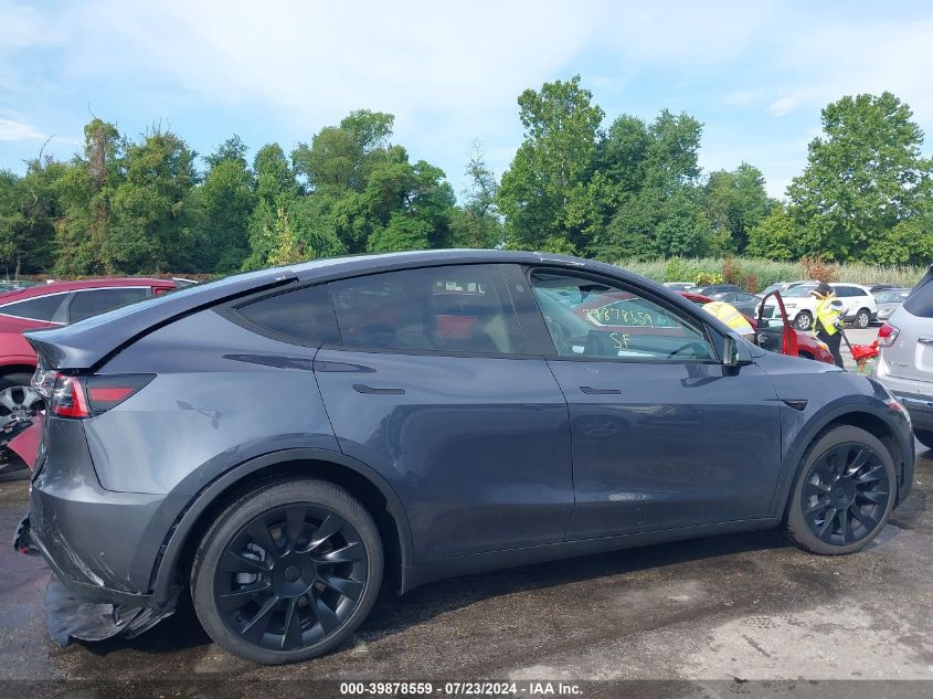 2023 Tesla Model Y Awd/Long Range Dual Motor All-Wheel Drive VIN: 7SAYGDEE3PA180824 Lot: 39878559