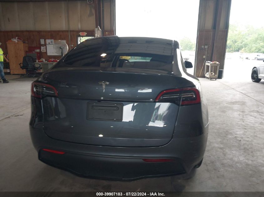 2023 Tesla Model Y Awd/Long Range Dual Motor All-Wheel Drive VIN: 7SAYGDEE9PF676147 Lot: 39907183