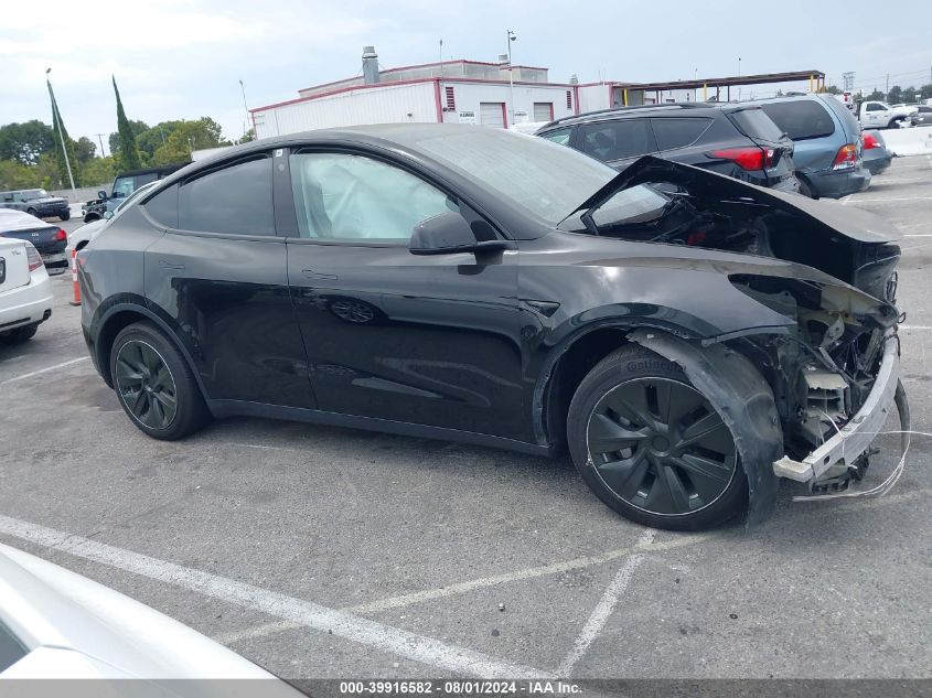 2023 Tesla Model Y Awd/Long Range Dual Motor All-Wheel Drive VIN: 7SAYGAEE0PF618667 Lot: 39916582