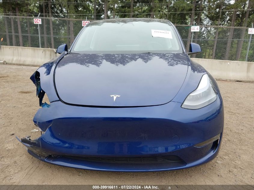 2023 Tesla Model Y Awd/Long Range Dual Motor All-Wheel Drive VIN: 7SAYGDEE4PF694376 Lot: 39916611