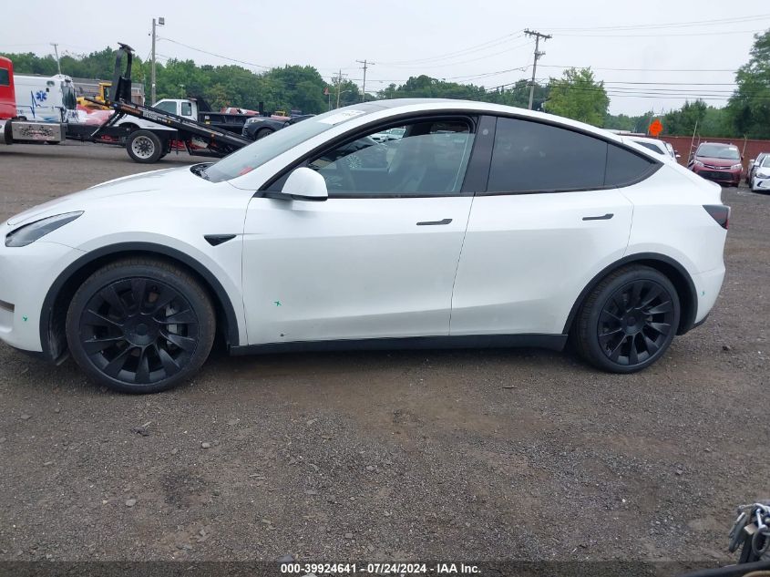 2023 Tesla Model Y Awd/Long Range Dual Motor All-Wheel Drive VIN: 7SAYGDEE7PA054465 Lot: 39924641