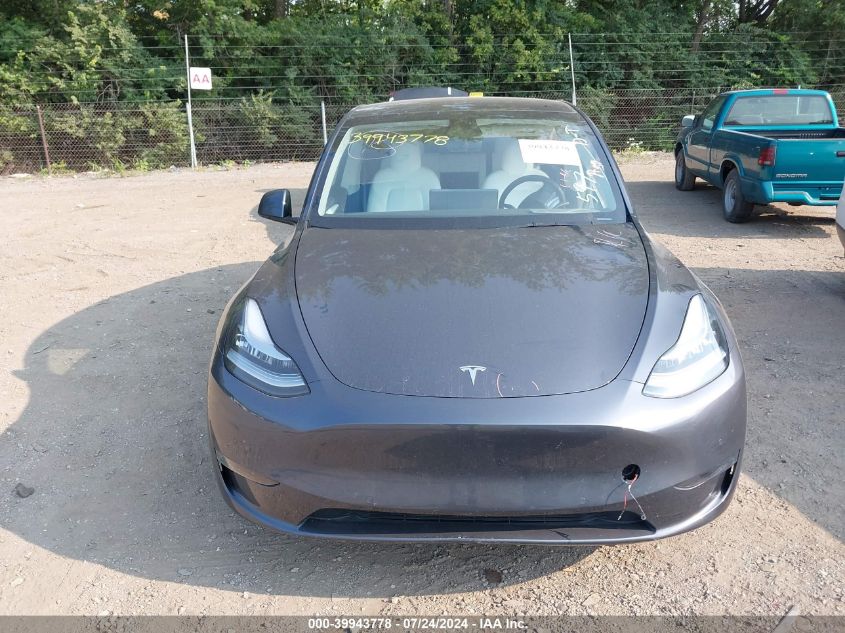 2023 Tesla Model Y Awd/Long Range Dual Motor All-Wheel Drive VIN: 7SAYGAEE9PF590710 Lot: 39943778