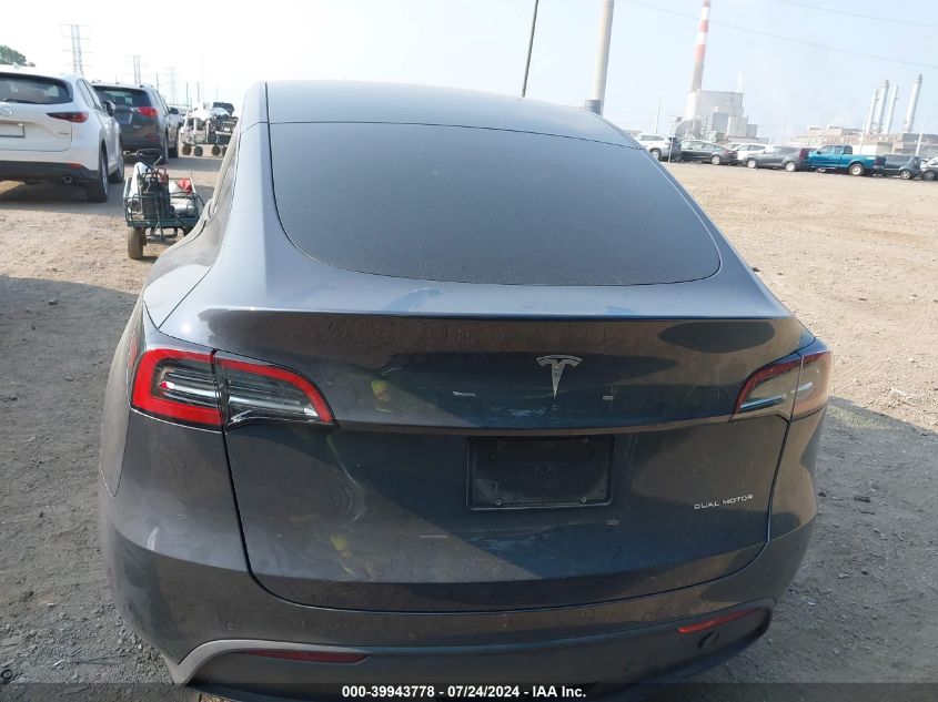 2023 Tesla Model Y Awd/Long Range Dual Motor All-Wheel Drive VIN: 7SAYGAEE9PF590710 Lot: 39943778